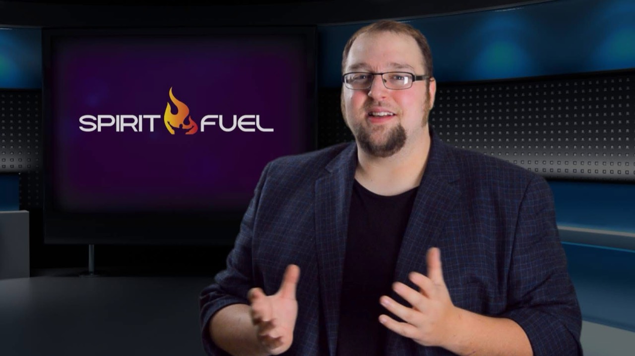 Thomas Griffin on camera in front of a Spirit Fuel branded studio background