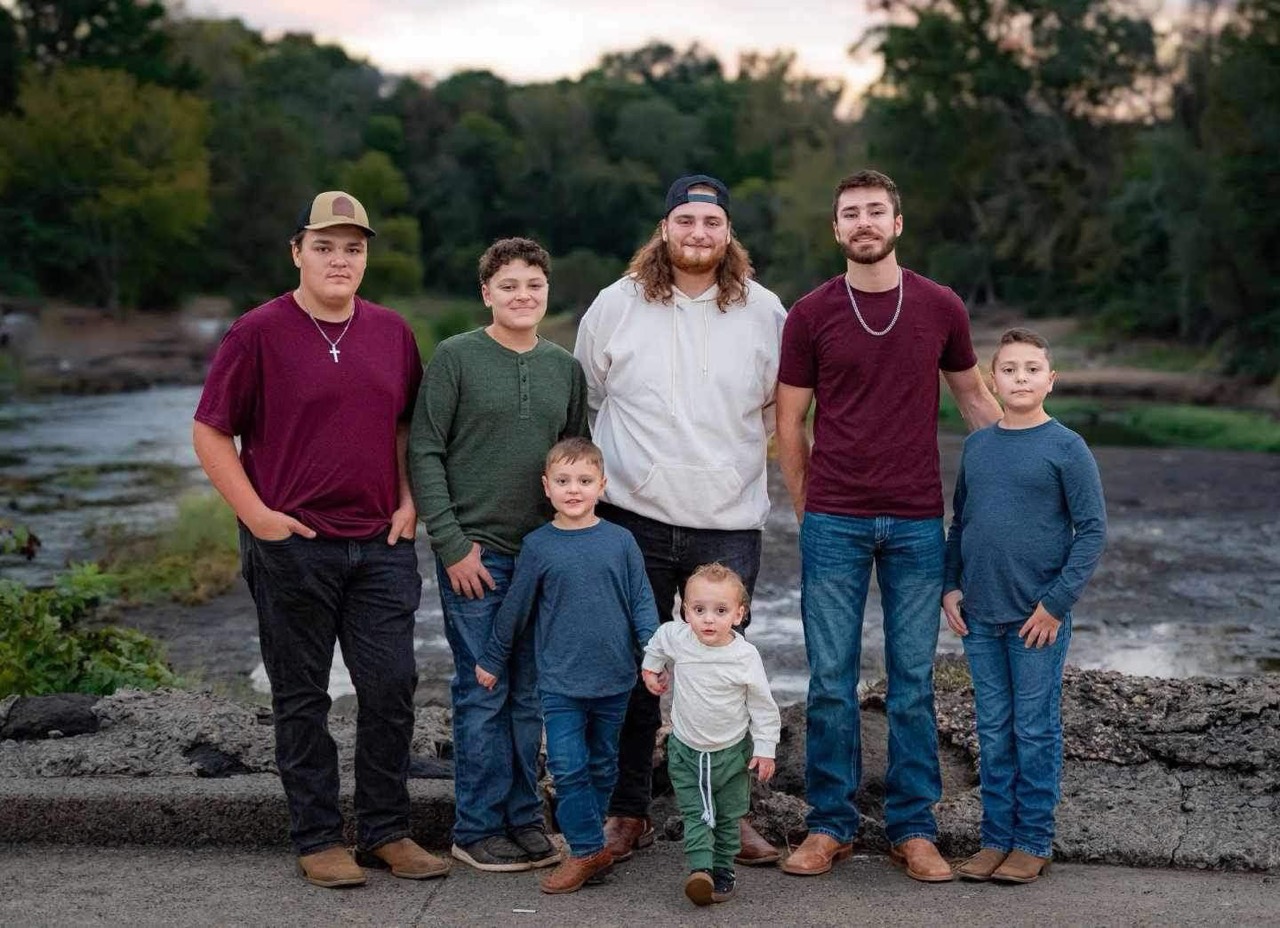 Thomas and Mandi Griffin's seven sons together beside a river