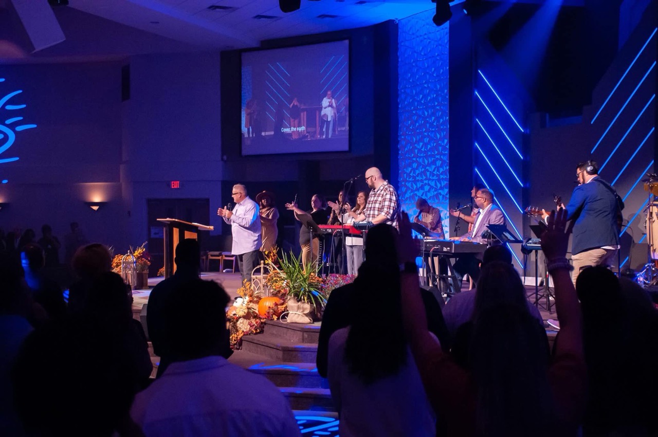 Thomas serving at the keyboard with a church worship team