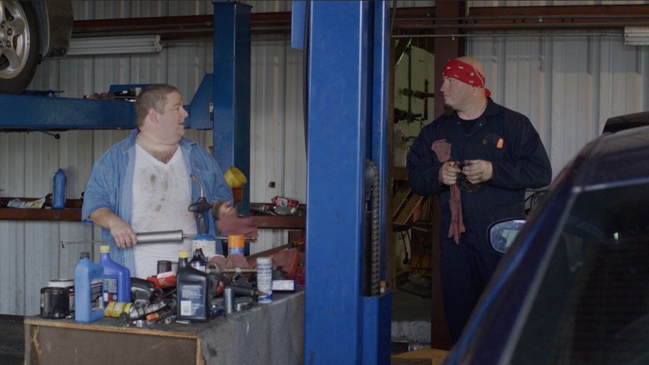 The Rescue garage scene with two cast members